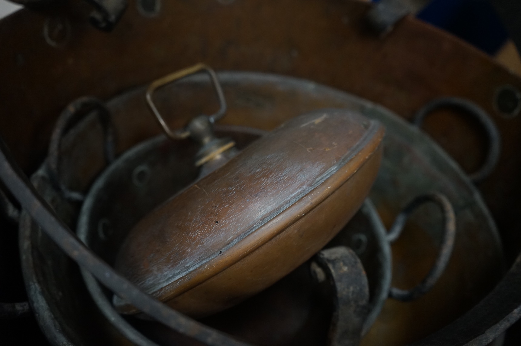 Four copper pans and a copper warming vessel
